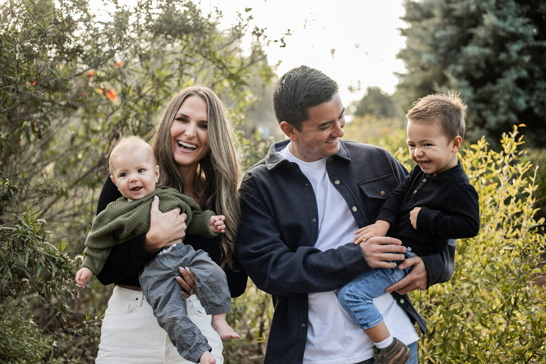Jon Gryn with his wife Debbie and their two sons in a Cypress garden